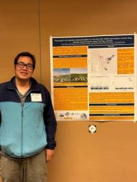 Man standing next to a research poster.