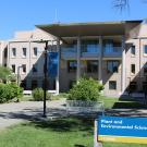 Building with sign in front saying "Plant and Environmental Sciences"